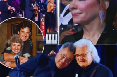 Vince Gill Leaves the Opry in Tears with a Devastating “Go Rest High on That Mountain” 💔🎶 The house went still when Vince Gill stepped to the mic at the Grand Ole Opry. With a trembling voice, he asked everyone to pause—to remember the loved ones we carry in our hearts. He honored his mother, nearing her 100th birthday… then whispered the line that broke the room: “This is about her son.” A century of a mother’s love. A son gone too soon. In that instant, the song became a prayer—shared grief, shared hope, shared tears.