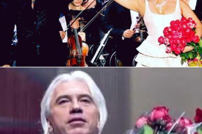 Under the soft glow of stage lights that bathed the grand Moscow concert hall in a warm, amber haze, Dmitry Hvorostovsky stepped forward, commanding the silence with a presence both regal and intimate; the audience held their breath as his rich baritone began to weave through the air, each note filling the room with a haunting blend of nostalgia and yearning that seemed to echo off the ornate walls; the subtle rustle of the orchestra, the gentle flicker of candles, and the rapt faces of listeners created a sacred space where time slowed and emotions surged; with English subtitles guiding those far from the Russian tongue, “Moscow Nights” became more than a song—it was a shared journey through the heart of a city and its people, illuminated by Hvorostovsky’s masterful artistry and the palpable magic of the moment.