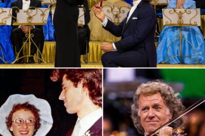“Will you be my wife… one more time?” — the unexpected line from André Rieu’s lips made the entire 15,000-person auditorium silent for a few seconds. On the stage shimmering with lights, the waltz king knelt down, took Marjorie’s hand – the person who had accompanied him for decades, and then reenacted the sweet proposal of the past right in the middle of the splendid concert. The audience burst into tears, thousands of eyes sparkled, because that moment was not just music, but a symphony of eternal love. Marjorie shook her head and nodded, her lips smiling slightly in the thunderous applause that echoed like a storm, lasting forever. The music continued, but now each melody carried the weight of memories, of vows, of a love that transcended time. That night, when leaving the auditorium, more than fifteen thousand spectators felt their hearts had just been touched by the sweetest miracle that music and love could bring.