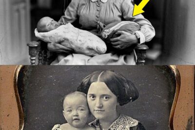 In 1906, a mother holds her baby in her arms – until everyone freezes when they see what she is holding.